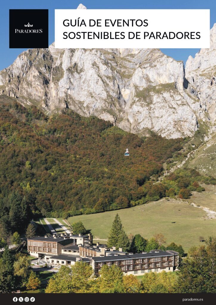 Vista aérea de un parador rodeado de montañas y vegetación